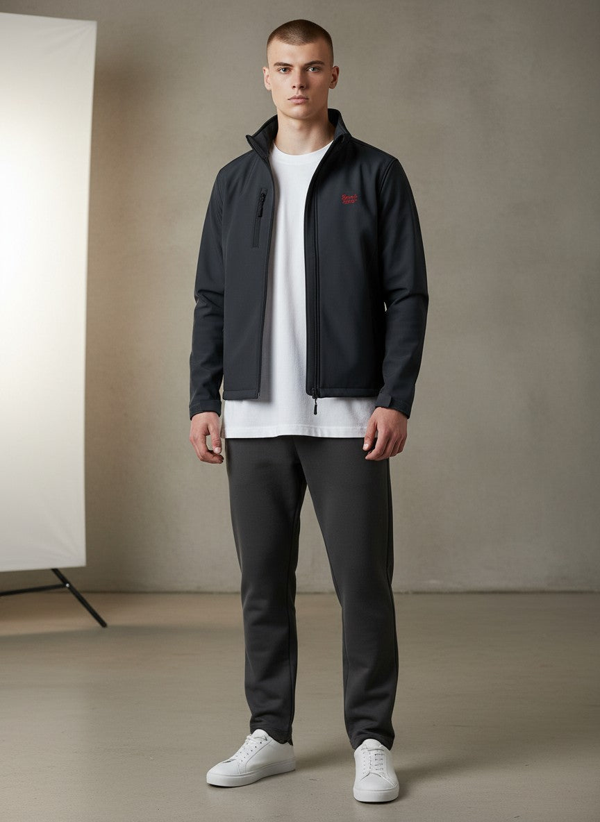 BeachBodyz® dark navy softshell jacket with red logo, zip pockets, and stand-up collar. Water-resistant and breathable streetwear.