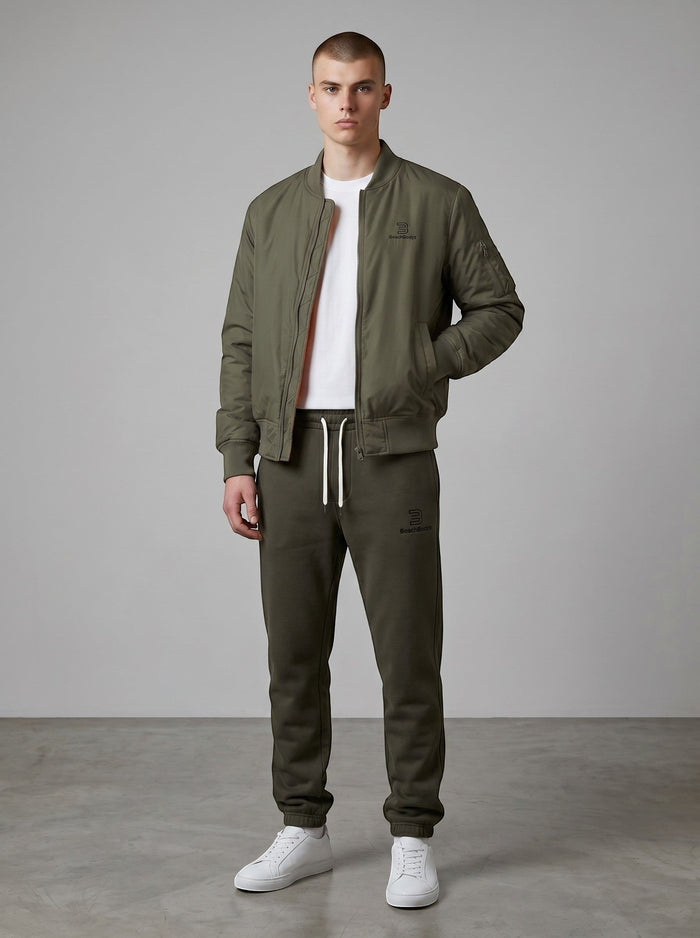 BeachBodyz® dark olive green bomber jacket with orange lining, ribbed cuffs, and zip closure.