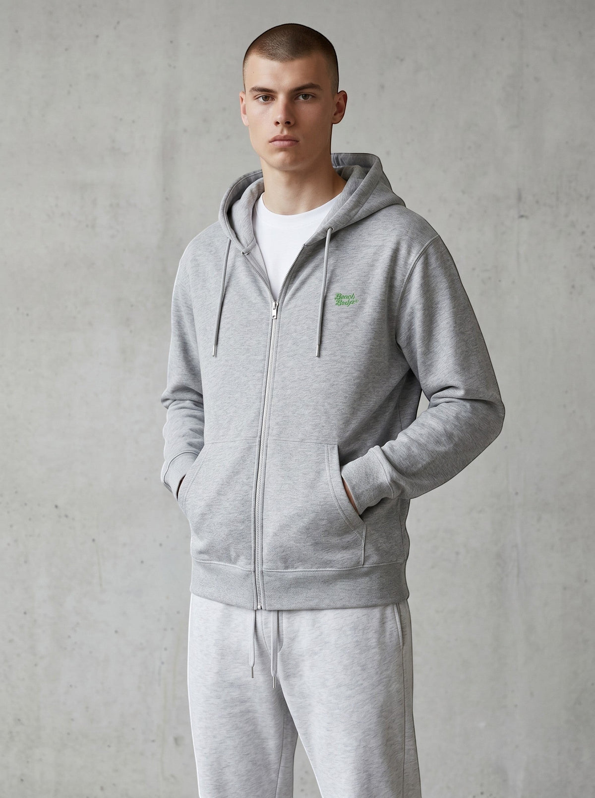 BeachBodyz® heather grey zip-up hoodie with embroidered logo on chest, made from soft organic cotton blend.