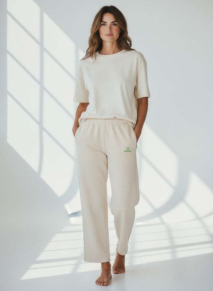 BeachBodyz® light beige cotton blend jogging pants with green logo detail. Comfortable streetwear style for men and women.