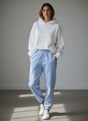 BeachBodyz® light blue cotton-polyester blend jogging pants with embroidered logo on left thigh and elastic waistband.