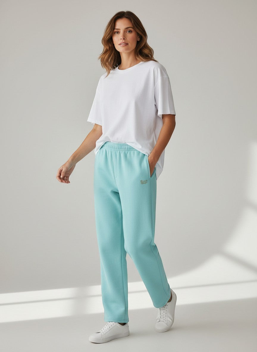 BeachBodyz® light blue cotton-polyester blend jogging pants with elastic waistband and subtle logo embroidery.