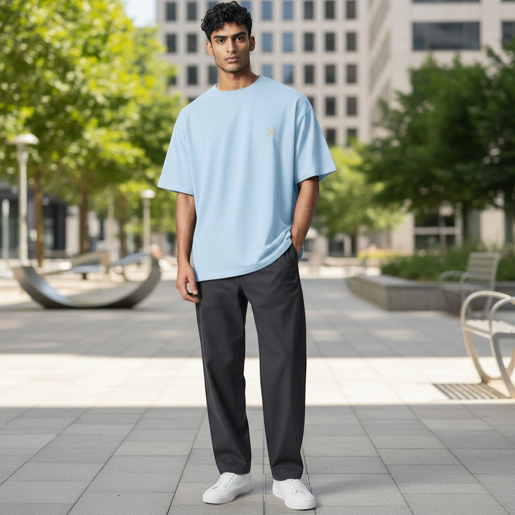 BeachBodyz® light blue oversized cotton t-shirt with gold logo on chest. Casual streetwear style.