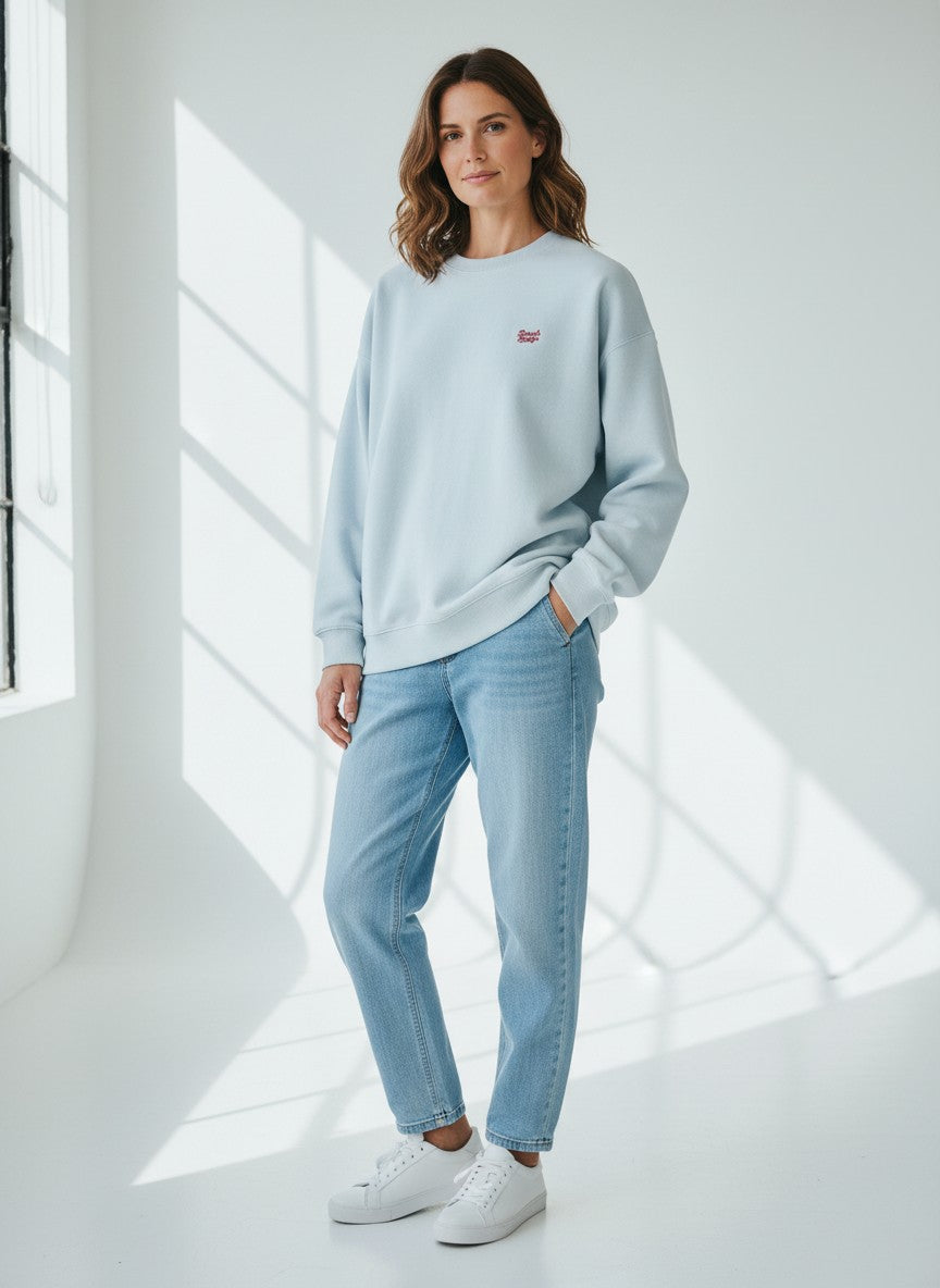 BeachBodyz® light blue oversized sweatshirt made from organic cotton with a small red embroidered logo on the chest.