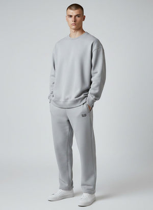 BeachBodyz® light grey cotton blend joggers with elastic waistband and subtle logo embroidery. Comfortable streetwear for men and women.
