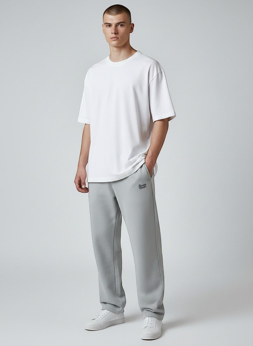 BeachBodyz® light grey oversized fluffy jogging pants with elastic waistband and subtle logo embroidery.