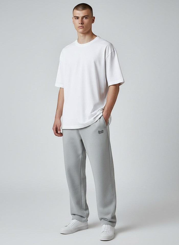 BeachBodyz® light grey oversized fluffy jogging pants with elastic waistband and subtle logo embroidery.