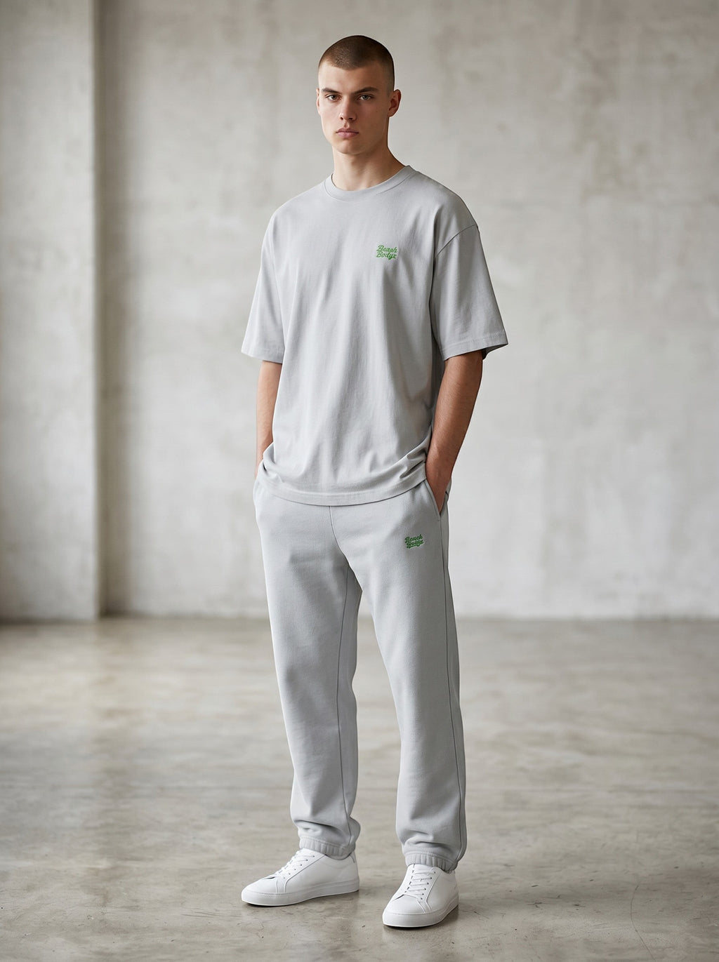 BeachBodyz® light grey oversized fluffy cotton blend jogging pants with green logo embroidery.
