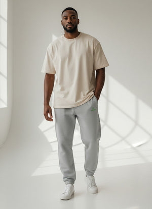 BeachBodyz® light grey fluffy cotton blend oversized jogging pants with green logo. Elastic waistband and cuffs.