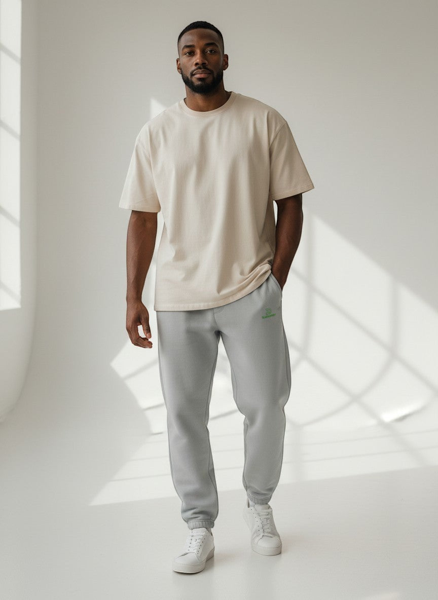 BeachBodyz® light grey fluffy cotton blend oversized jogging pants with green logo. Elastic waistband and cuffs.