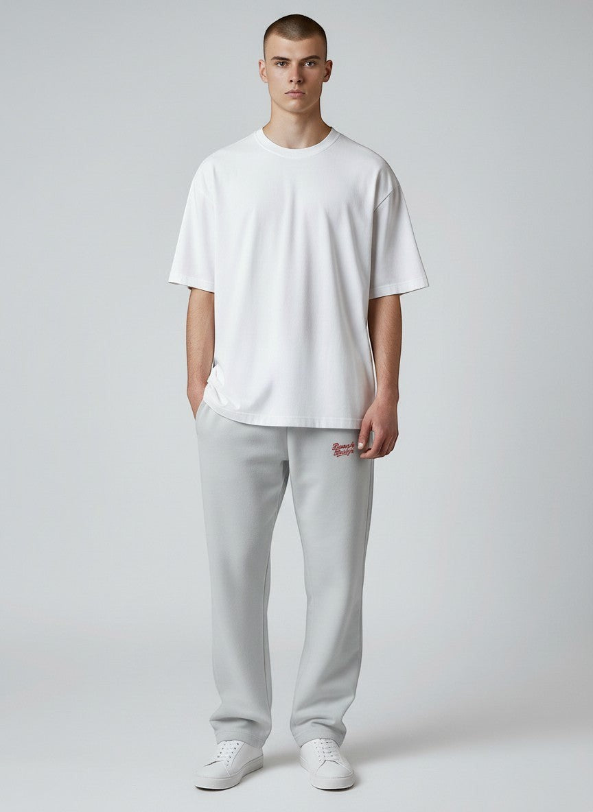 BeachBodyz® light grey fluffy oversized jogginghose with red logo embroidery and cuffed ankles.