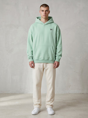 BeachBodyz® light mint green oversized hoodie made from bio-cotton with a small embroidered logo on the chest.