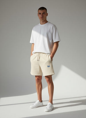 BeachBodyz® natural raw cotton blend jogger shorts with blue embroidered logo and drawstring waist.