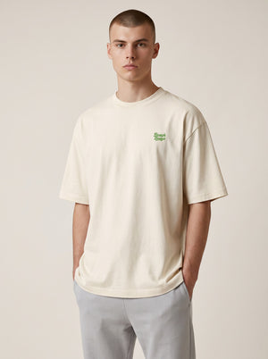 BeachBodyz® natural raw organic cotton oversized t-shirt with green embroidered logo on chest.