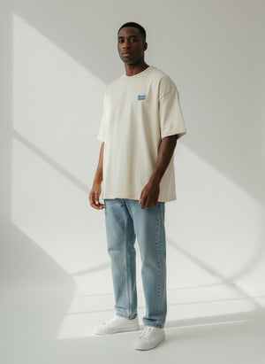 BeachBodyz® natural raw oversized t-shirt made from organic cotton with blue embroidered logo.