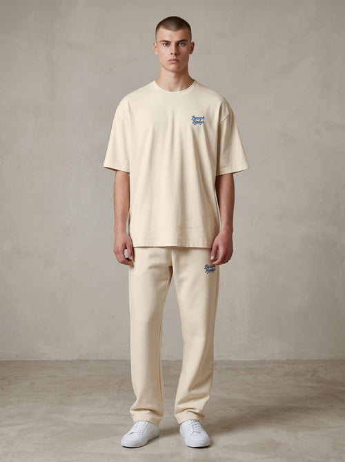 BeachBodyz® natural raw organic cotton oversized t-shirt with blue embroidered logo on chest.