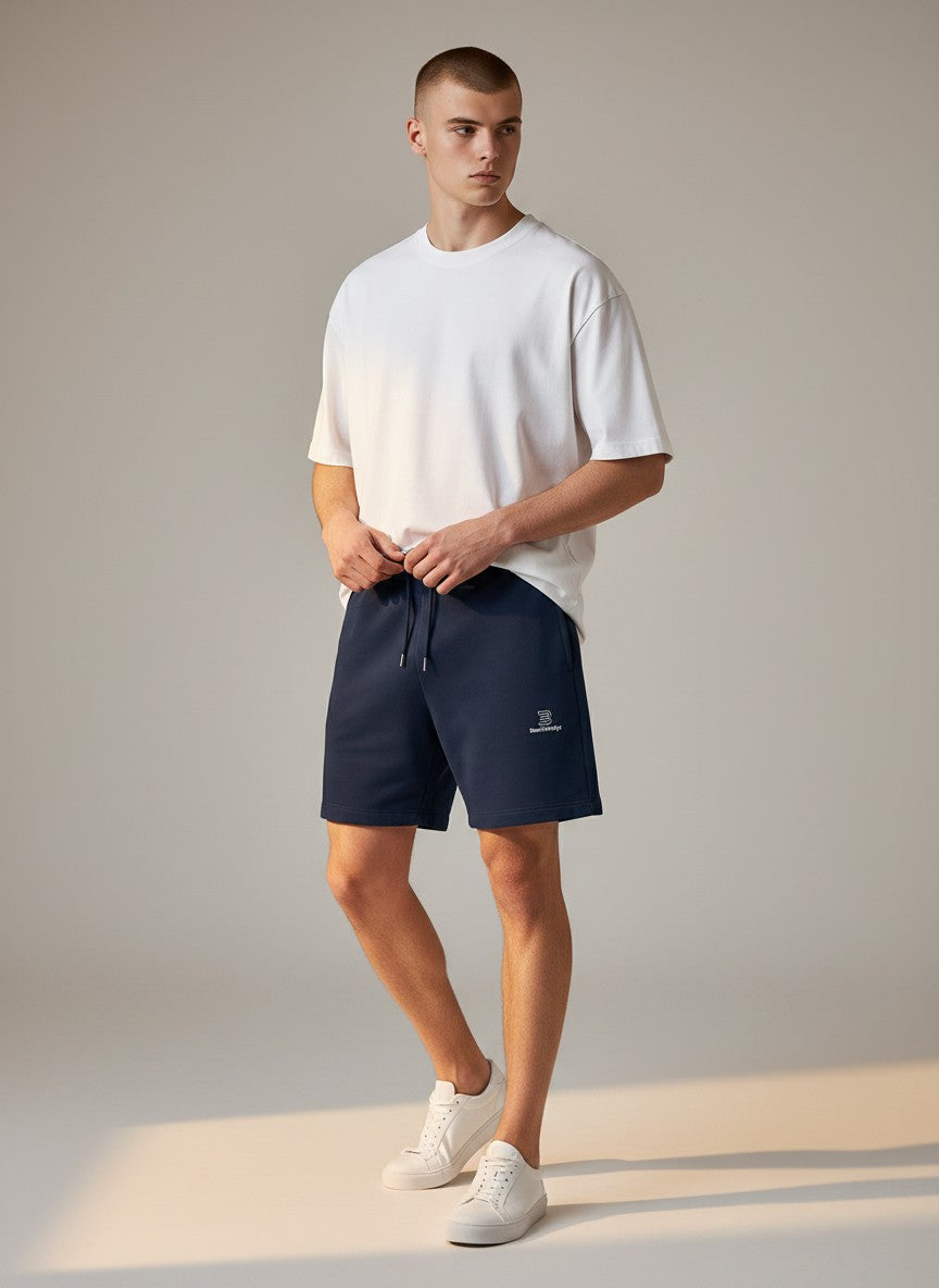 BeachBodyz® navy blue jogger shorts with embroidered logo on the left leg, drawstring waist, and relaxed fit.