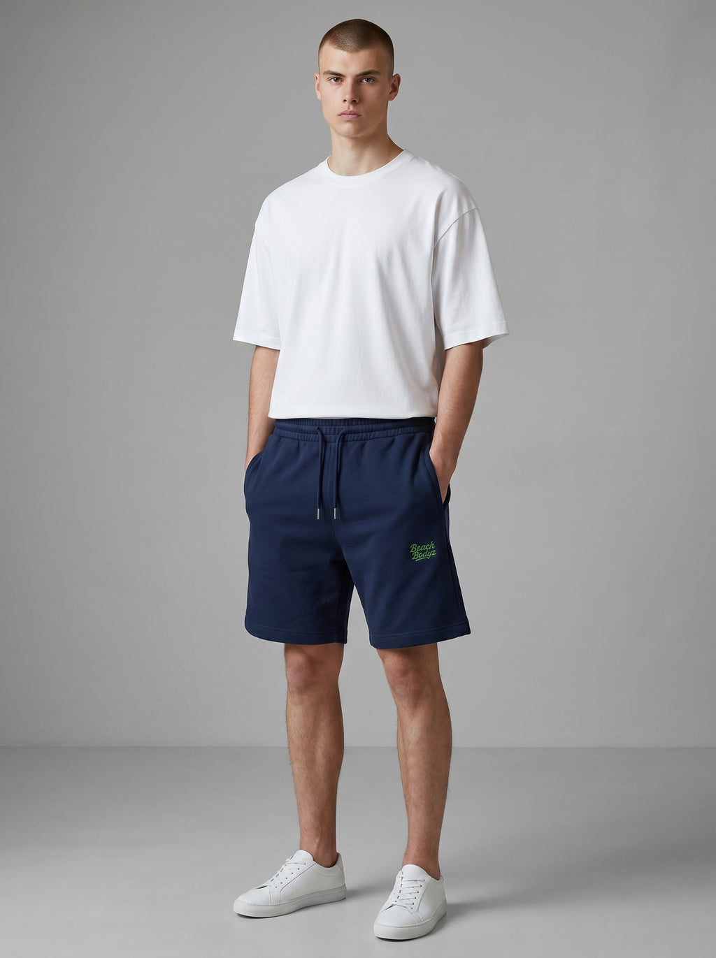 BeachBodyz® navy blue jogger shorts with embroidered logo, made from organic cotton blend, featuring drawstring waist and pockets.