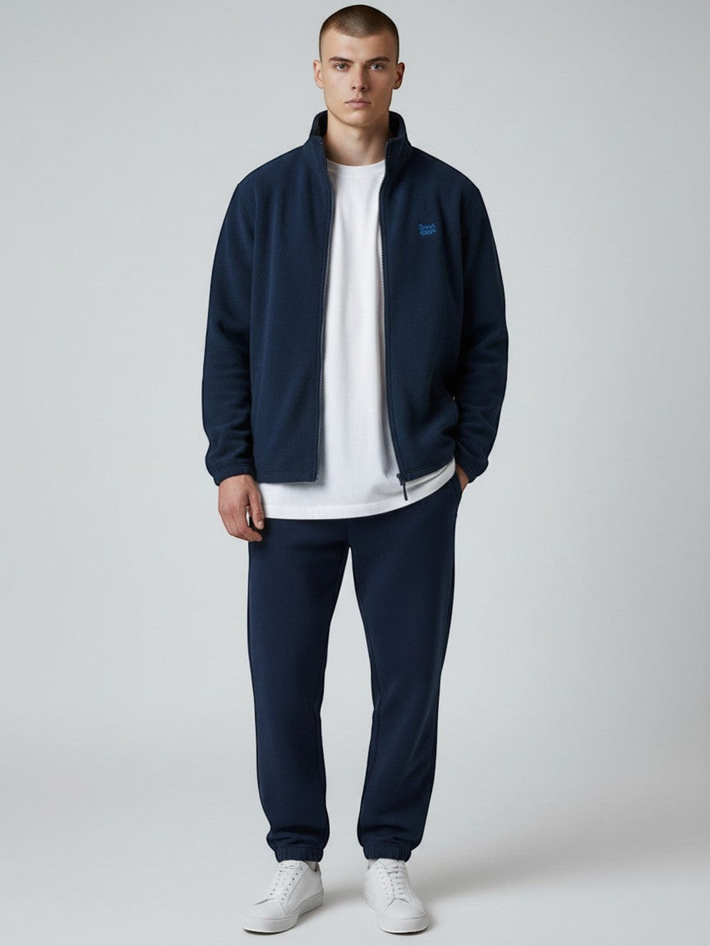 BeachBodyz® navy blue fleece jacket with embroidered logo on chest, full zip, and side pockets. Streetwear style.