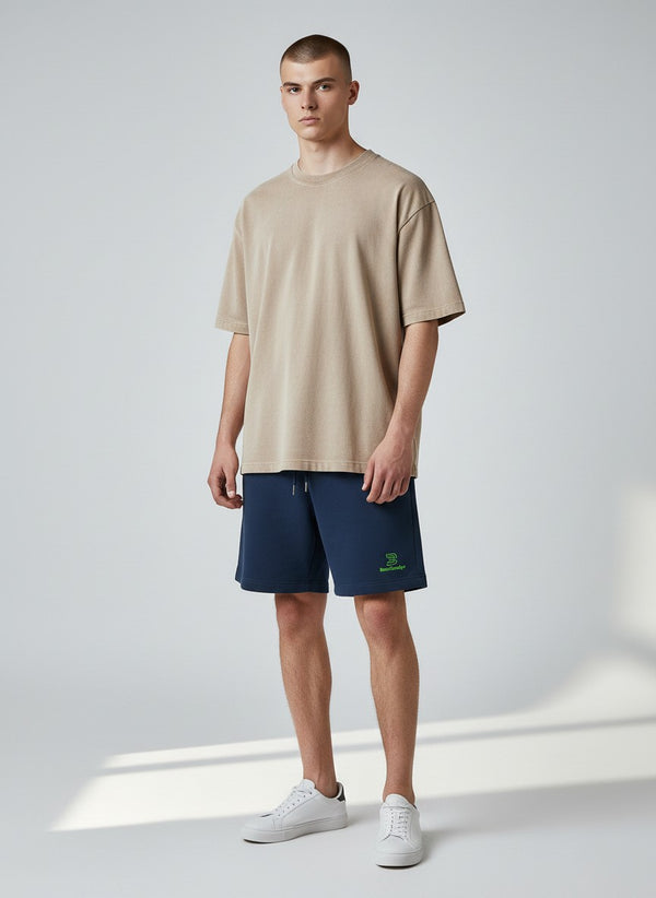BeachBodyz® navy blue organic cotton jogger shorts with embroidered logo and drawstring waist. Casual streetwear style.