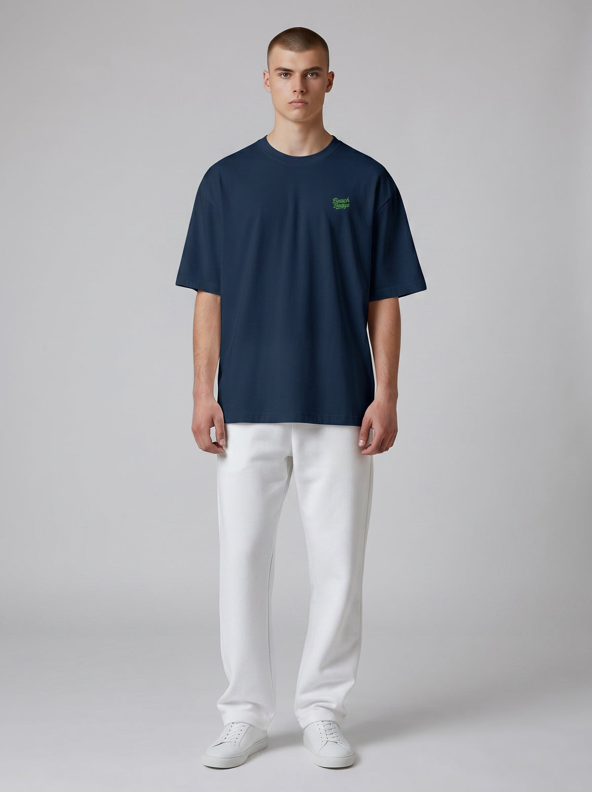BeachBodyz® navy blue oversized t-shirt made from organic cotton with a small green embroidered logo on the chest.