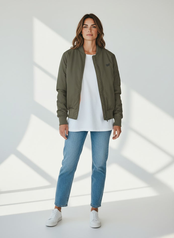 BeachBodyz® olive green bomber jacket for men and women with orange lining and zippered sleeve pocket.