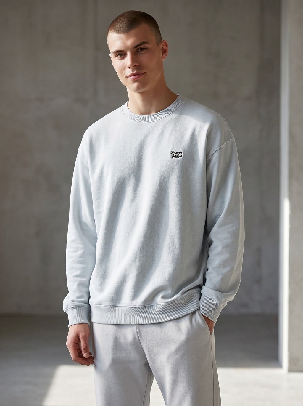 BeachBodyz® light blue oversized sweatshirt made from organic cotton with embroidered logo on chest.