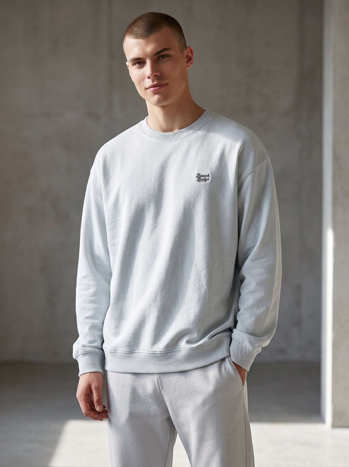 BeachBodyz® light blue oversized sweatshirt made from organic cotton with embroidered logo on chest.