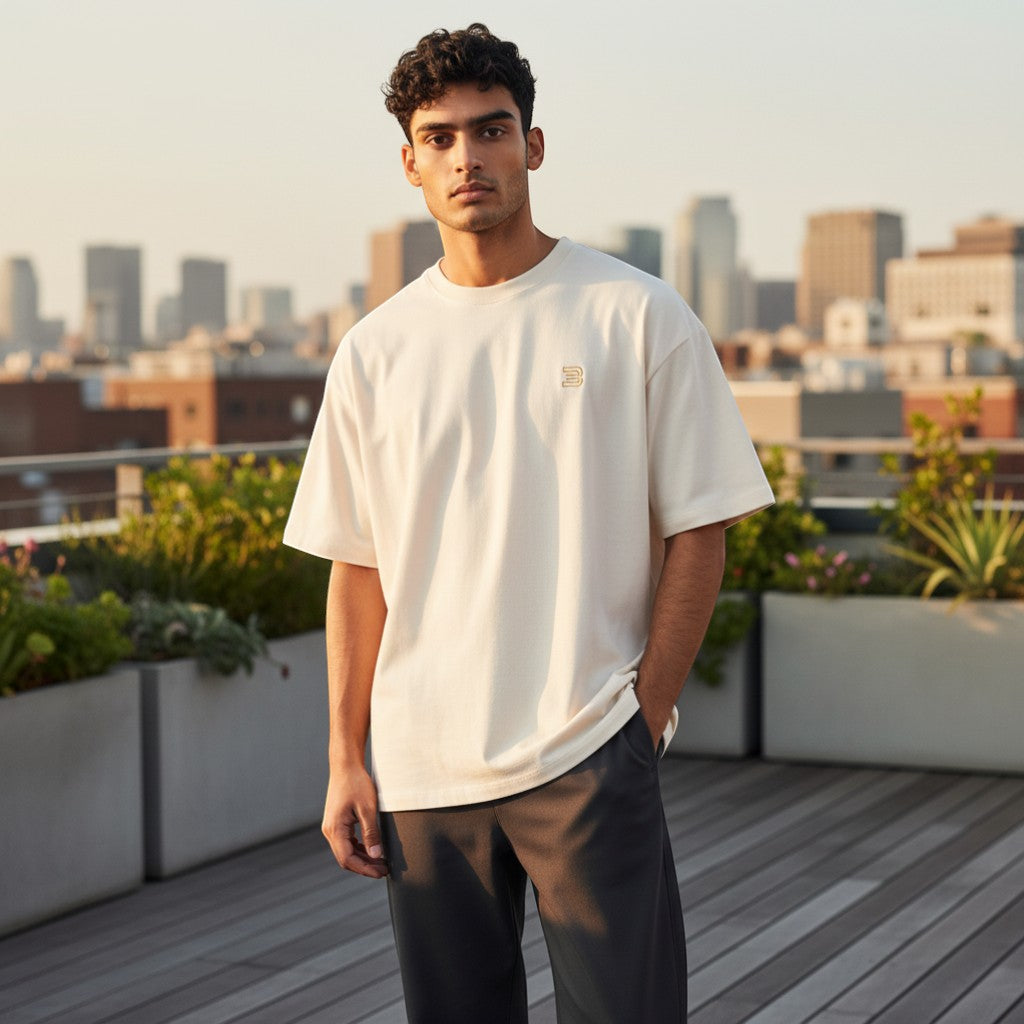 BeachBodyz® oversized cream cotton t-shirt with a small gold logo on the chest. Perfect for streetwear.