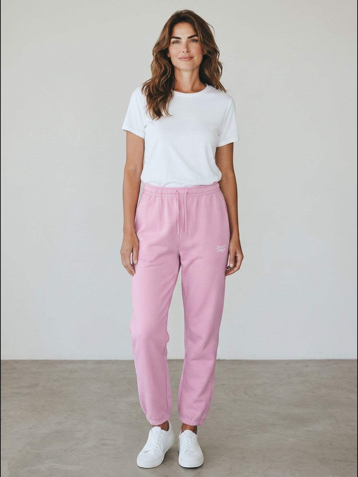 BeachBodyz soft pink fluffy cotton blend sweatpants with elastic waistband and cuffs, featuring subtle logo embroidery.