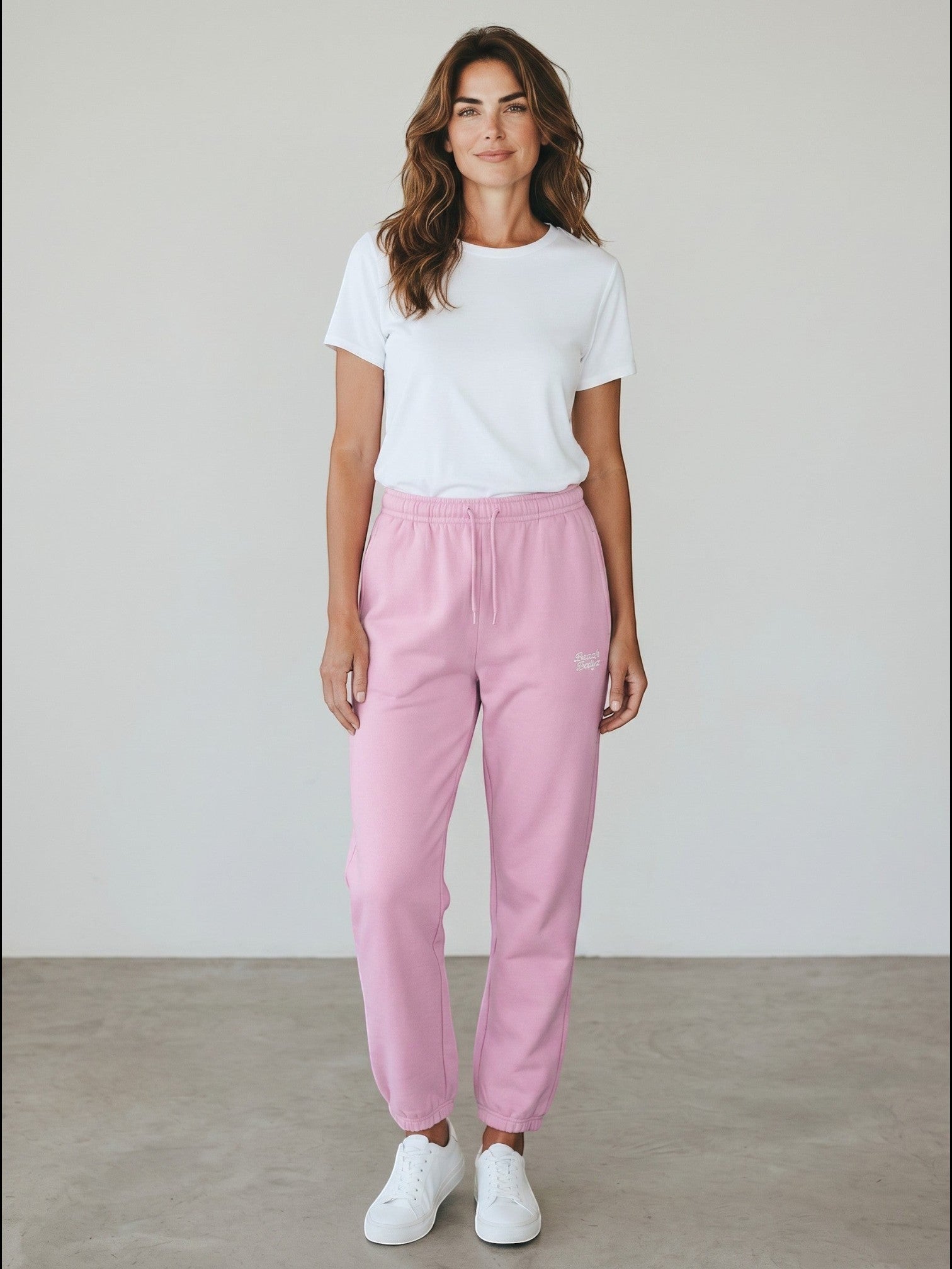 BeachBodyz soft pink fluffy cotton blend sweatpants with elastic waistband and cuffs, featuring subtle logo embroidery.