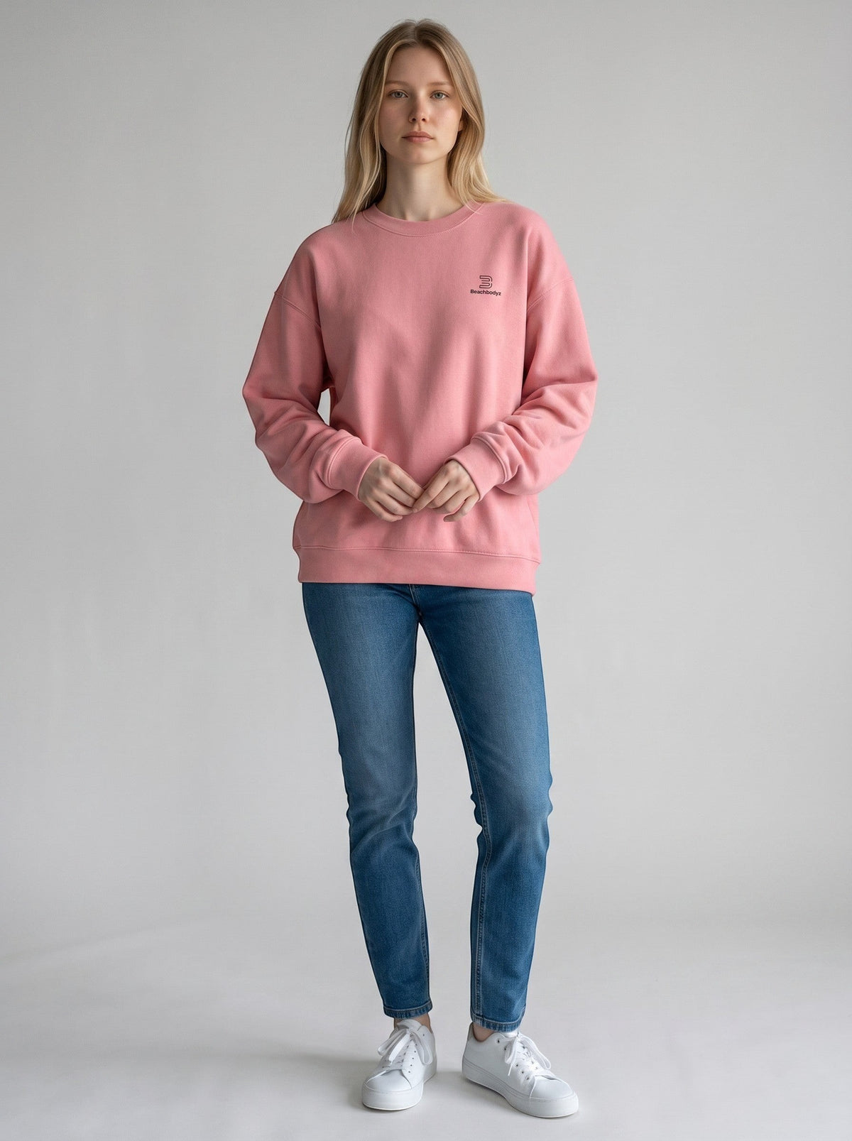 BeachBodyz® pink oversized sweatshirt with subtle embroidered logo on chest, made from organic cotton.