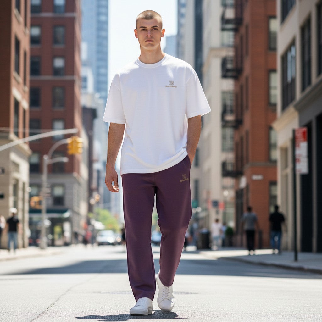 BeachBodyz® plum purple cotton blend jogging pants with elastic waistband and logo detail. Comfortable streetwear style.