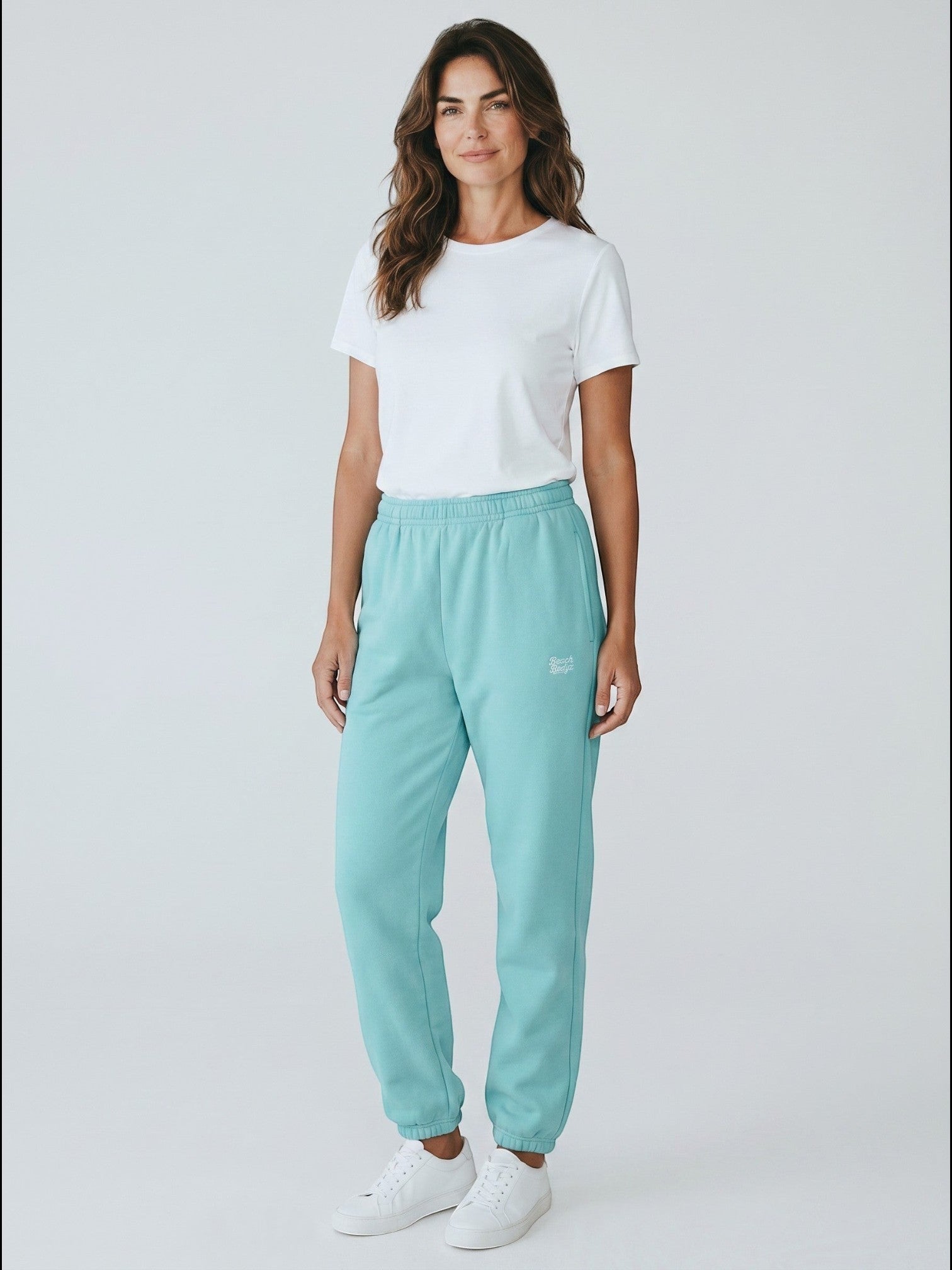 BeachBodyz® powder blue fluffy sweatpants with elastic waistband and cuffs, featuring subtle embroidered logo.