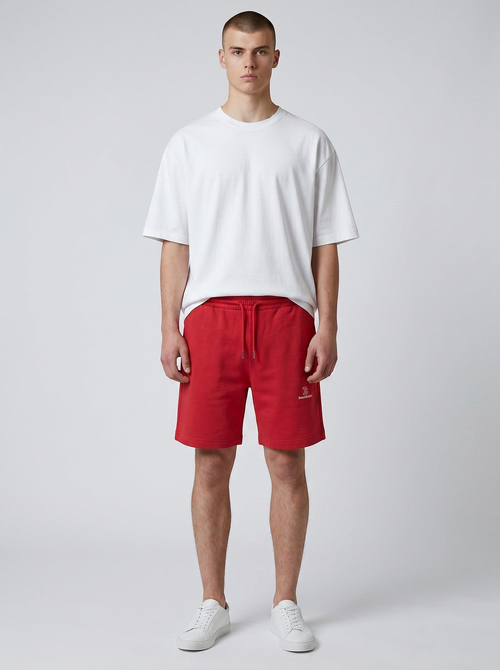 BeachBodyz® red cotton blend jogger shorts with embroidered logo on the right leg, drawstring waist, and pockets.