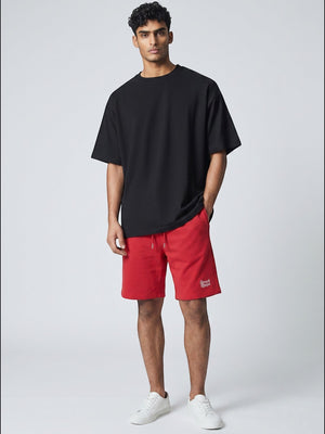 BeachBodyz® red cotton blend jogger shorts with white embroidered logo and drawstring waist.