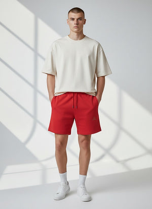 BeachBodyz® red organic cotton jogger shorts with embroidered logo and drawstring waist. Comfortable streetwear style.