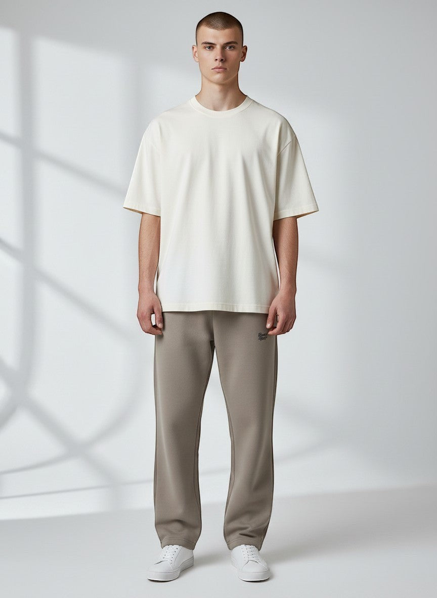 BeachBodyz® light taupe oversized fluffy jogging pants with elastic waistband and subtle logo.