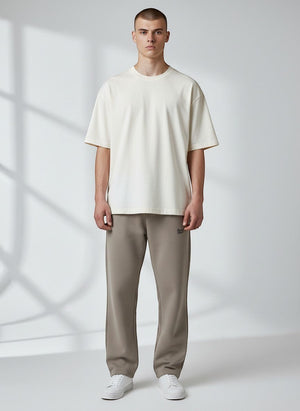BeachBodyz® light taupe oversized fluffy jogging pants with elastic waistband and subtle logo.