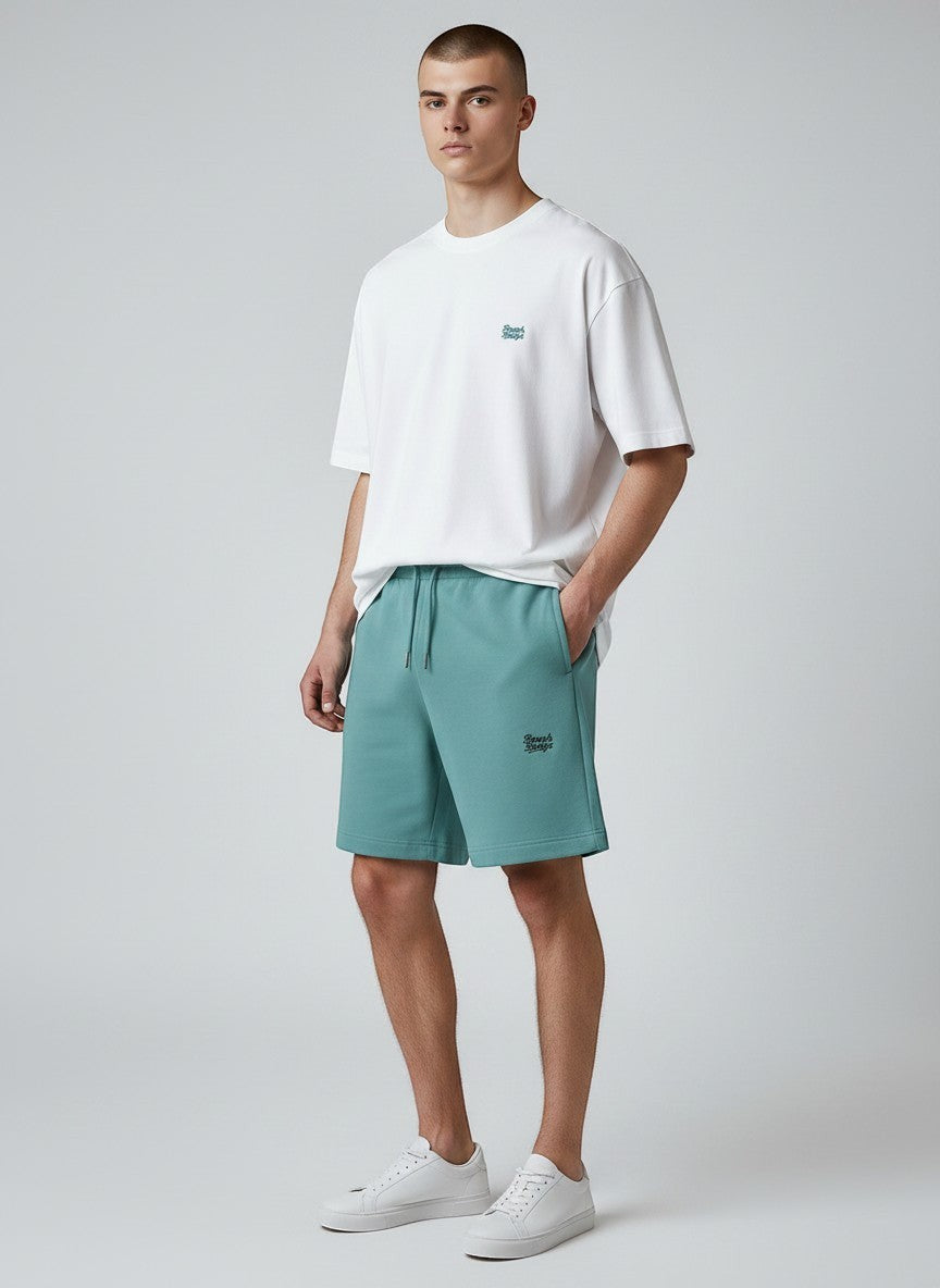 BeachBodyz® teal cotton blend jogger shorts with embroidered logo and drawstring waist. Comfortable streetwear style.