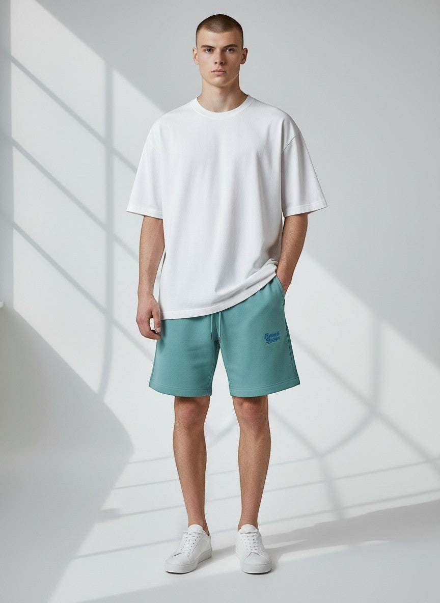 BeachBodyz® teal blue cotton blend jogger shorts with embroidered logo and drawstring waist.