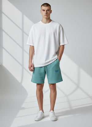 BeachBodyz® teal blue cotton blend jogger shorts with embroidered logo and drawstring waist.