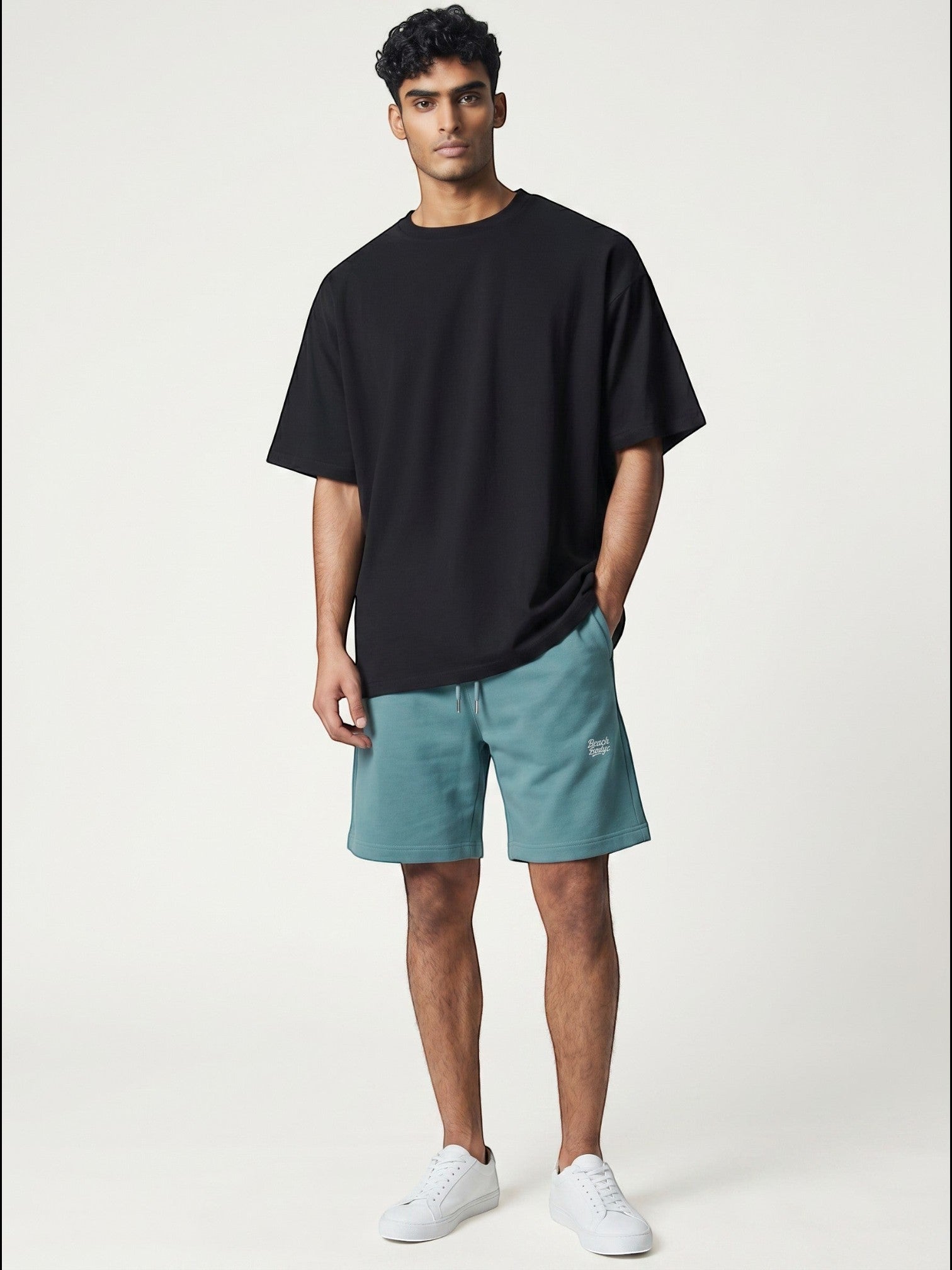 BeachBodyz® teal jogger shorts with embroidered logo, drawstring waist, and pockets. Made from soft organic cotton blend.