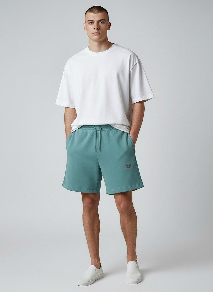 BeachBodyz® teal blue cotton jogger shorts with red embroidered logo and drawstring waist. Casual streetwear style.