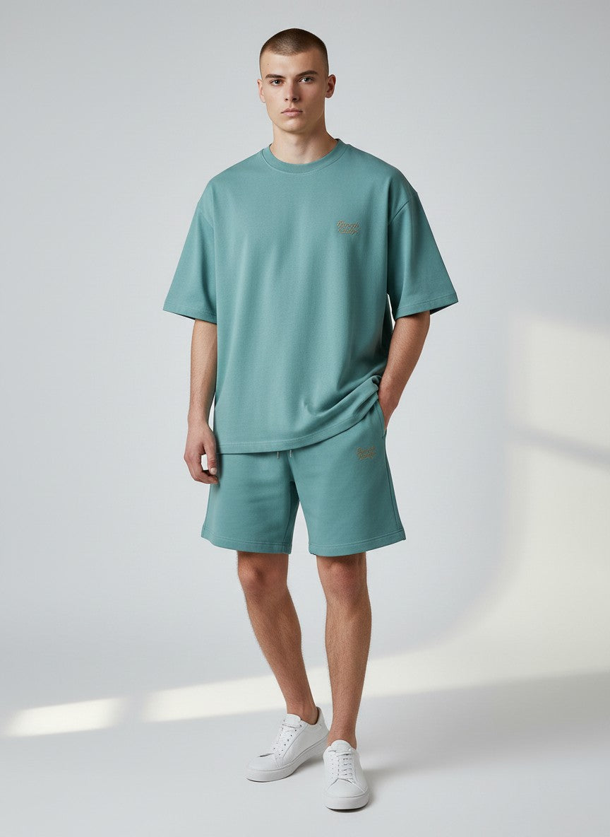 BeachBodyz® teal blue cotton blend jogger shorts with embroidered logo and drawstring waist.