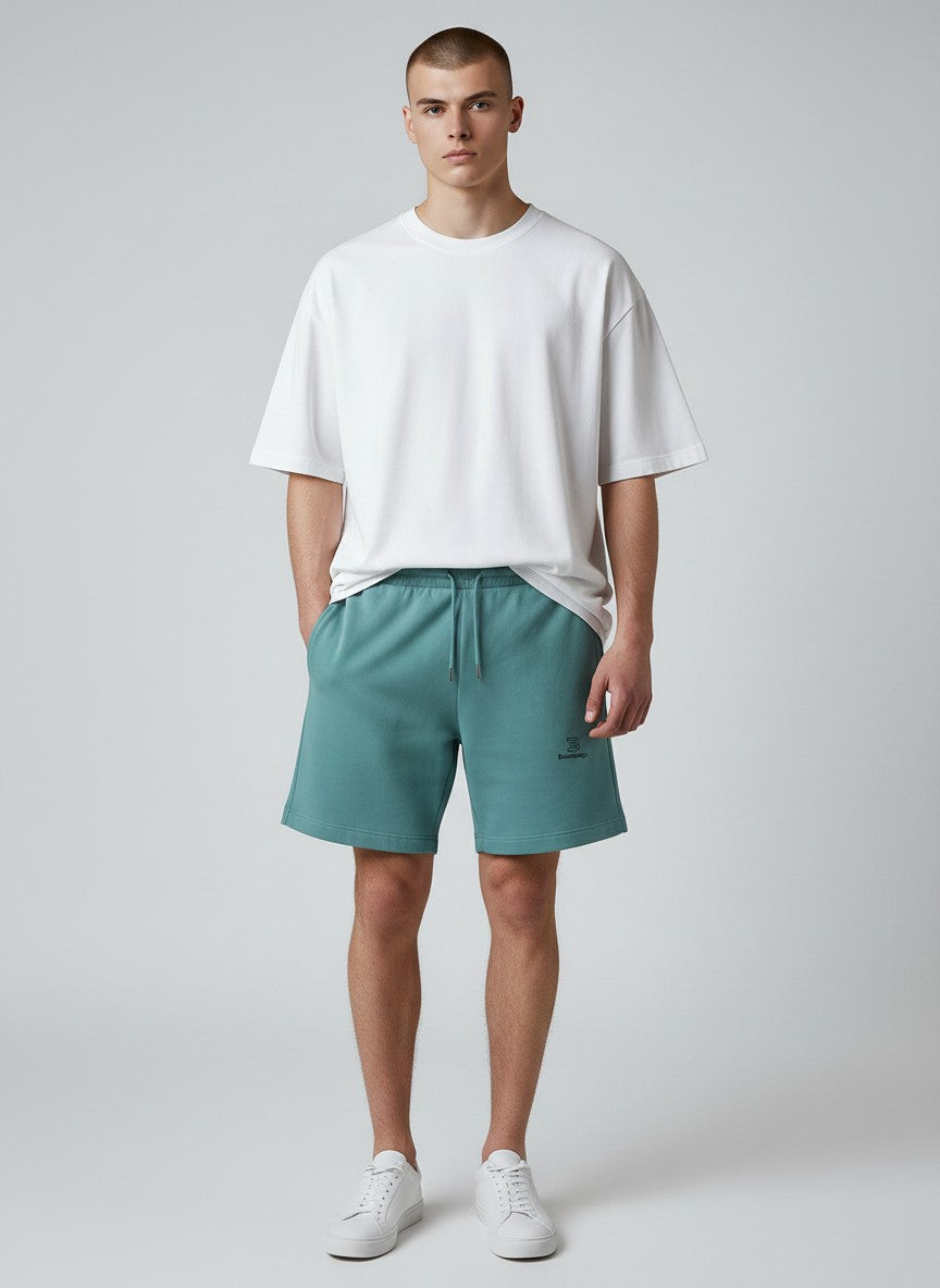 BeachBodyz® teal blue jogger shorts with embroidered logo and drawstring waist, made from organic cotton blend.