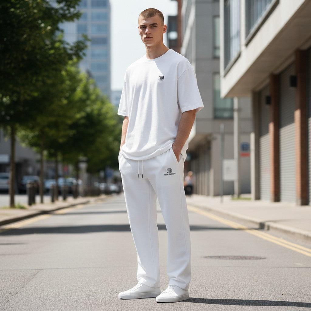 BeachBodyz® white cotton blend jogging pants with elastic waistband and side pockets.