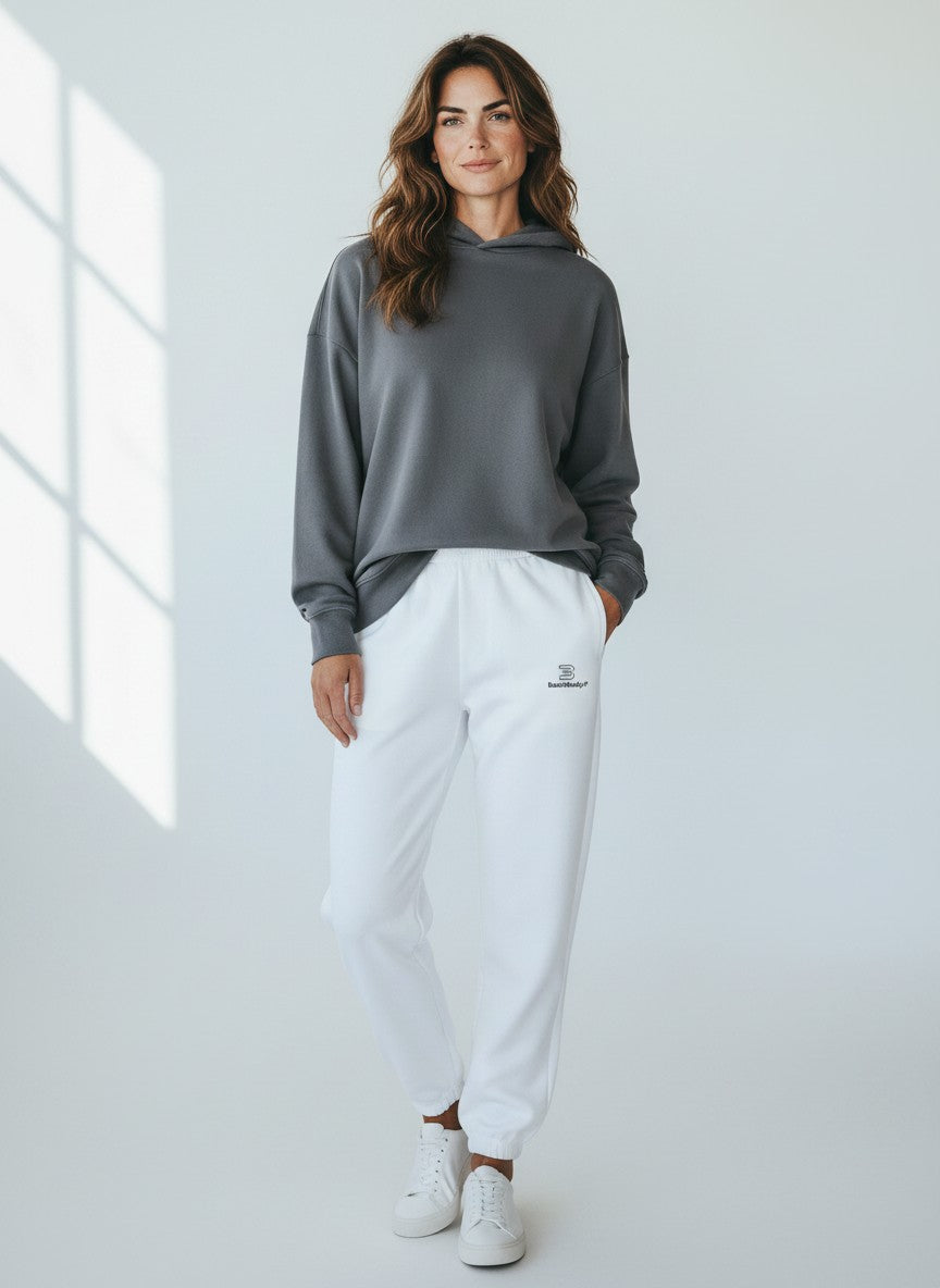 BeachBodyz® white fluffy oversized jogging pants with elastic waistband and cuffs, made from a soft cotton-polyester blend.