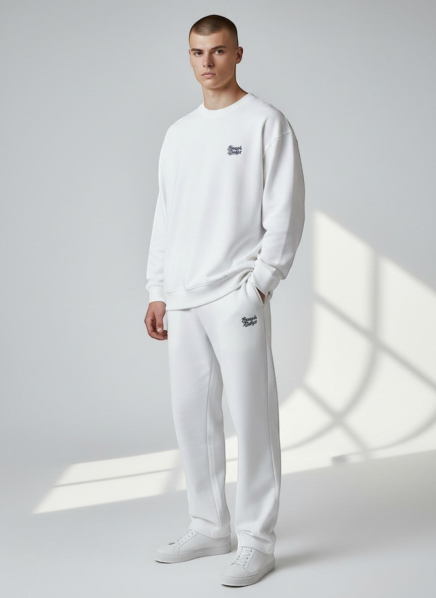 BeachBodyz® white fluffy oversized jogging pants with elastic waistband and drawstring, side pockets, and embroidered logo.