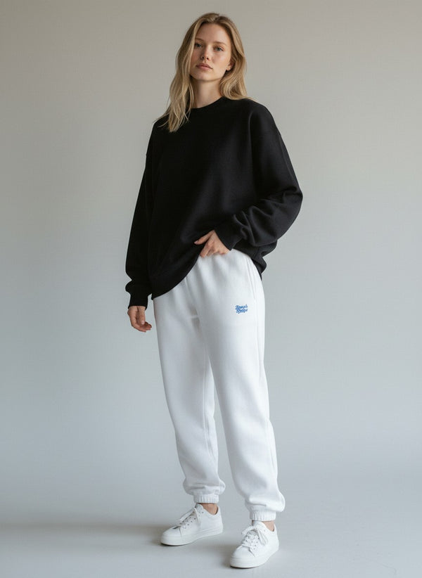 BeachBodyz® white fluffy cotton blend oversized jogging pants with blue logo detail.